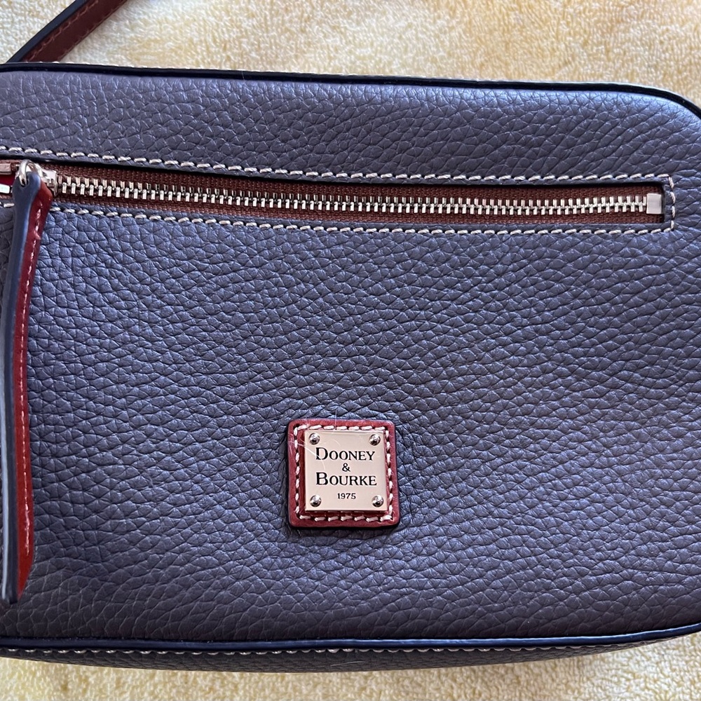 Dooney and Bourke grey camera bag with adjustable strap